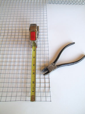 3. Use brass screen or galvanized wire mesh like the 1/2-inch rabbit fence used here (available at hardware stores). Cut the mesh with wire snips to be about 1/2-inch smaller than the frame in both directions. Bend it into the frame.